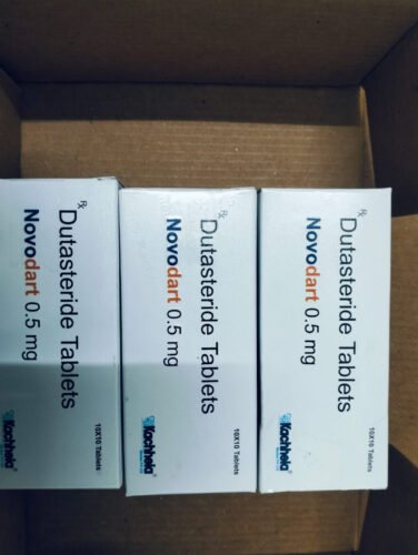 Three white boxes labeled Dutasteride Tablets 0.5 mg (Novodart) inside a cardboard box.